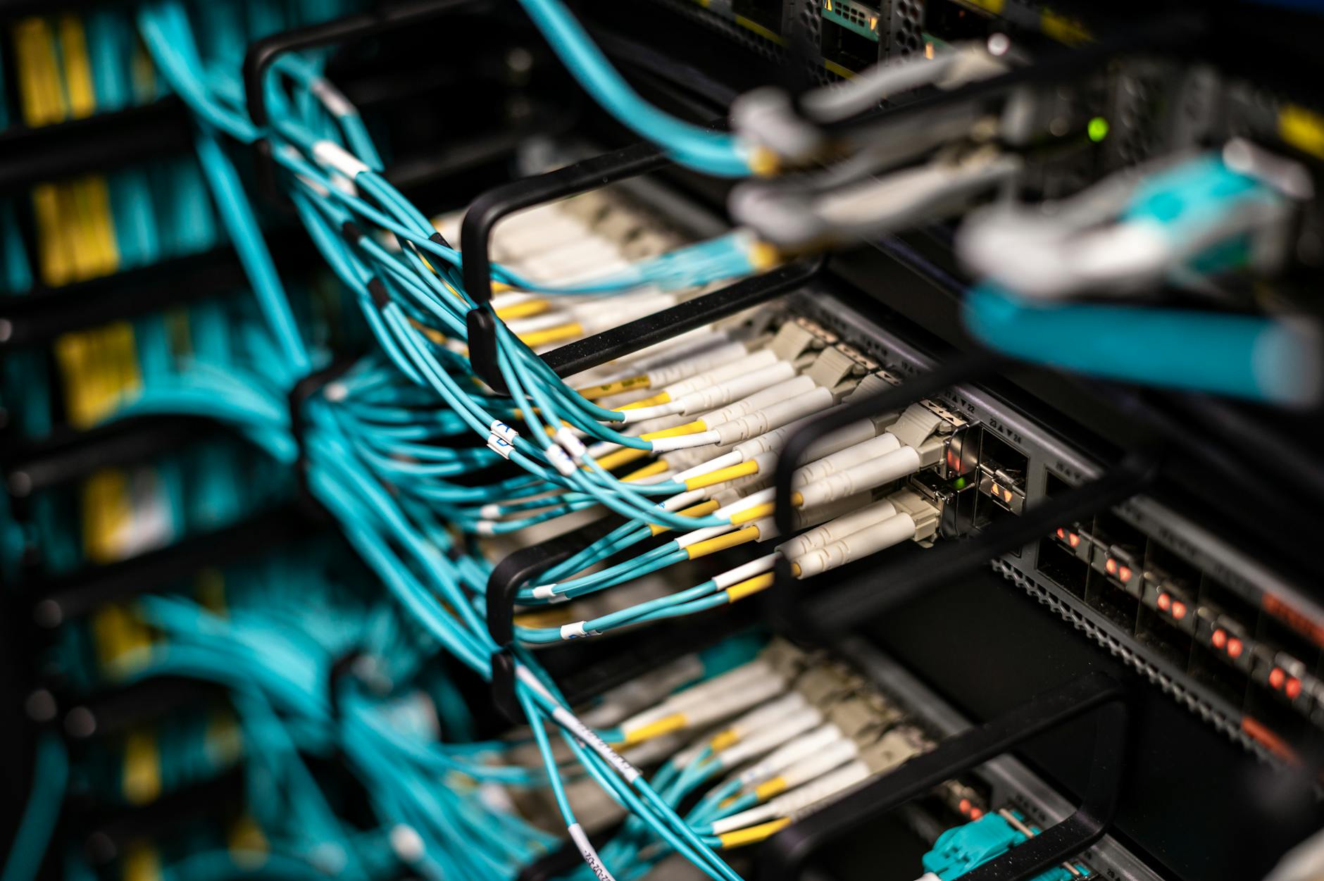 Numerous wires and cables mounted into server patch panel in modern data center