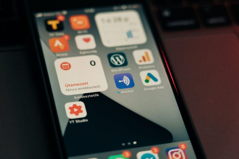 How to Automate WordPress Deployments with GitHub Actions Close-up view of smartphone screen featuring various app icons and notifications.