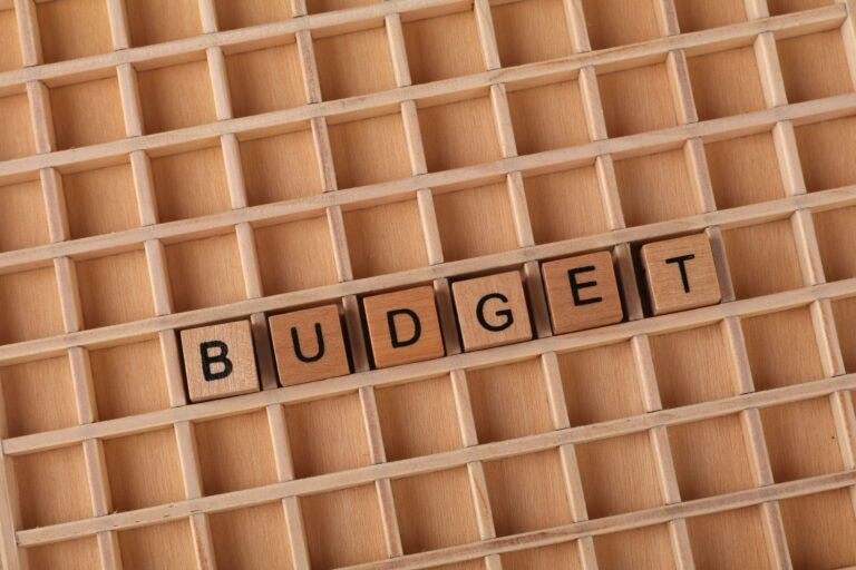 How to Set Up a Kubernetes Cluster on a Budget Wooden letter tiles spelling 'budget' on a wooden grid background, symbolizing finance and planning.